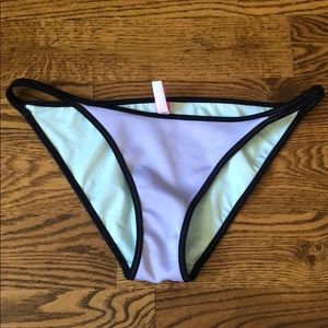 purple Victoria secret bathing suit bottoms
